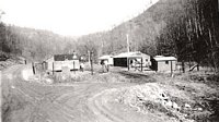 Camp Kanawha motor pool.  The trucks and men were on the road, at work when this picture was taken.