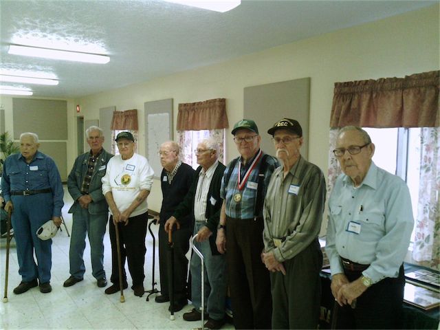 Left to right:  Wayne Franklin Blake, B.D. Linn, John Stogran, Glenn Childers, Kenneth Scribner, Harlen Frederick, Harold Wilson, and James Dolan Lewis.